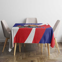 Printed blue, red, and white tablecloth on square dining table