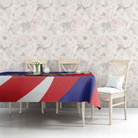 Blue and red tablecloth with bold white diagonal shapes on dining table