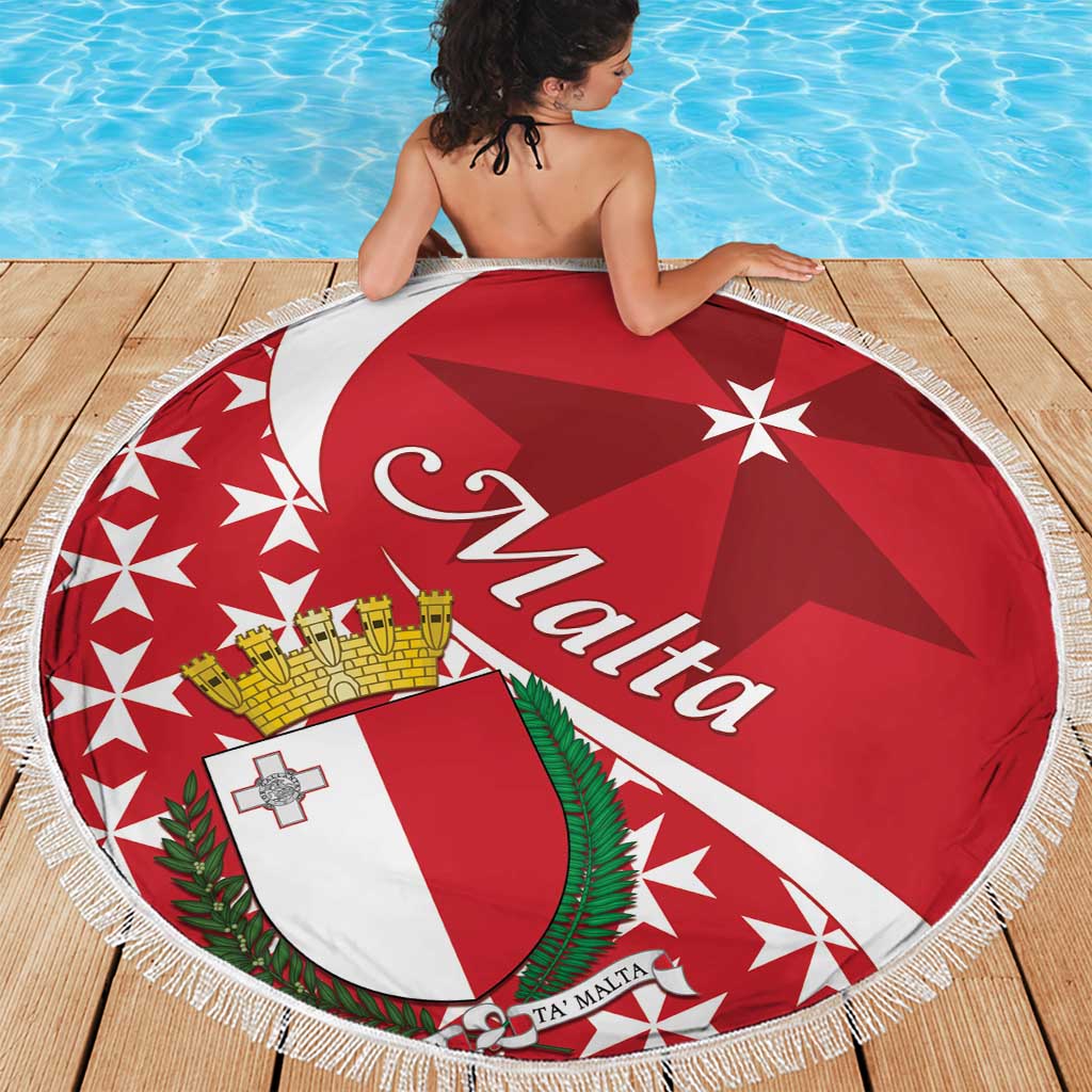 Person on a round red beach blanket showing Malta Cross, crest, and star pattern with fringe
