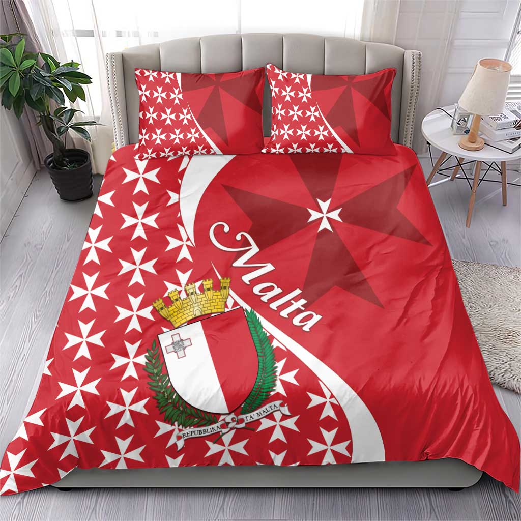 Red bedding set with Malta crest banner and Maltese cross star pattern, shown on a bed