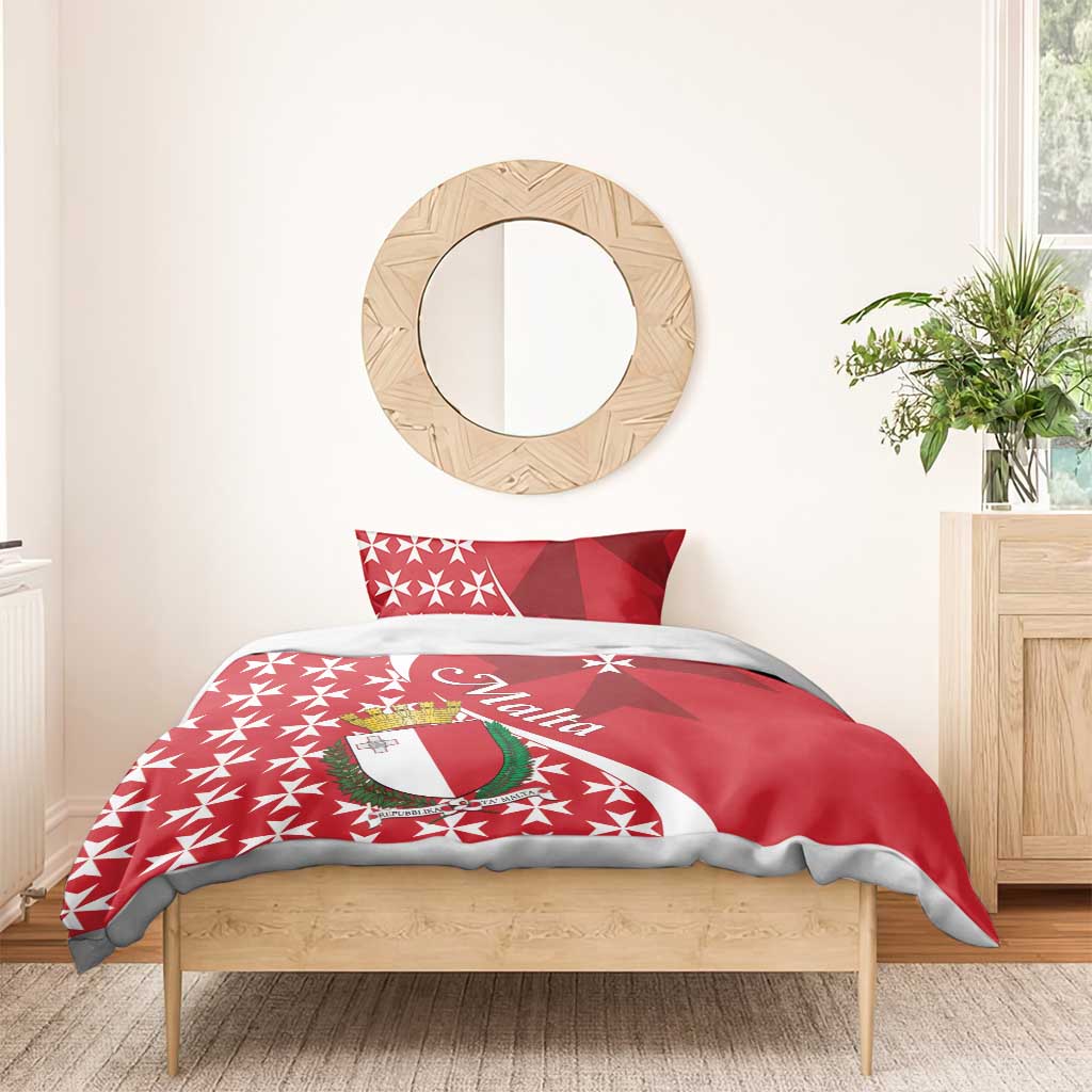 Red duvet and pillowcases with Malta crest and Maltese cross star pattern, styled on a bed