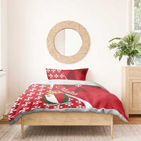 Red duvet and pillowcases with Malta crest and Maltese cross star pattern, styled on a bed