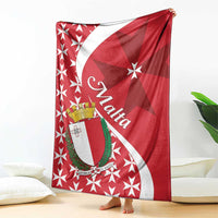 Red Malta themed blanket draped display with starburst Maltese cross and white shield