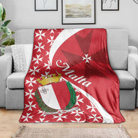 Red Malta themed throw blanket on sofa with Maltese cross star pattern and shield motif
