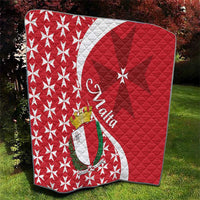 Malta quilt outdoors, red and white Maltese cross emblem with star burst pattern