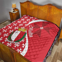Malta quilt on bed, red and white quilt with Maltese cross emblem and star pattern