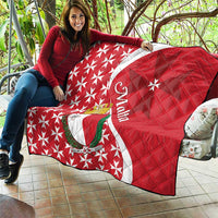 Malta quilt on patio, red and white Maltese cross star pattern with emblem