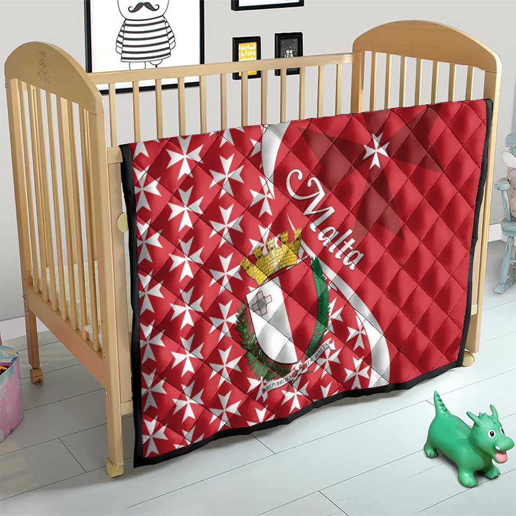 Malta quilt laid on crib, red and white Maltese cross with star pattern and emblem