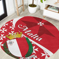 Red round carpet with Maltese cross, crest shield, stars, and 'Malta' text