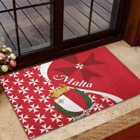 Red rubber doormat with Malta script and shield crest over starburst Maltese cross design