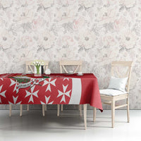 Red tablecloth with white star and Maltese Cross motifs, covering rectangular dining table