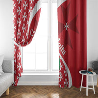 Red and white Maltese cross window curtains framing a central door and glass.