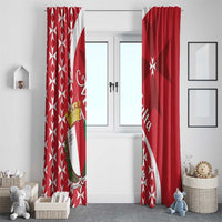 Red Maltese cross curtains with crest emblem, hanging symmetrically at a doorway.