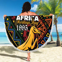 Round beach blanket with tassel fringe, bold Heritage Day 1995 design and springbok