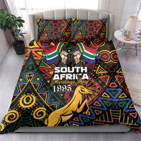Bedding set with geometric springbok design, matching pillowcases, and 'Heritage Day 1995' text