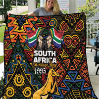 South Africa Heritage Day quilt with springbok, geometric tribal pattern, black base.