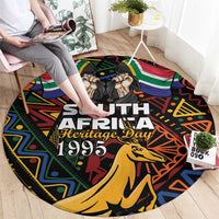 Black round carpet featuring 'South Africa Heritage Day 1995' and springbok graphic
