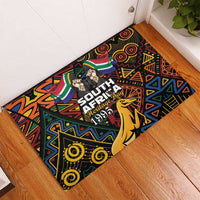 Rectangular rubber doormat with South Africa Heritage Day text and springbok graphic