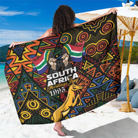 Black sarong with South Africa Heritage Day graphic, Springbok and geometric designs.