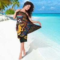 Black sarong with colorful tribal motifs, South Africa Heritage Day text and Springbok.