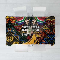 Black tablecloth with colorful African geometric pattern and springbok artwork, centered panel