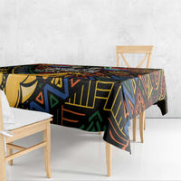 Black tablecloth with vibrant African geometric print, hanging over table edges