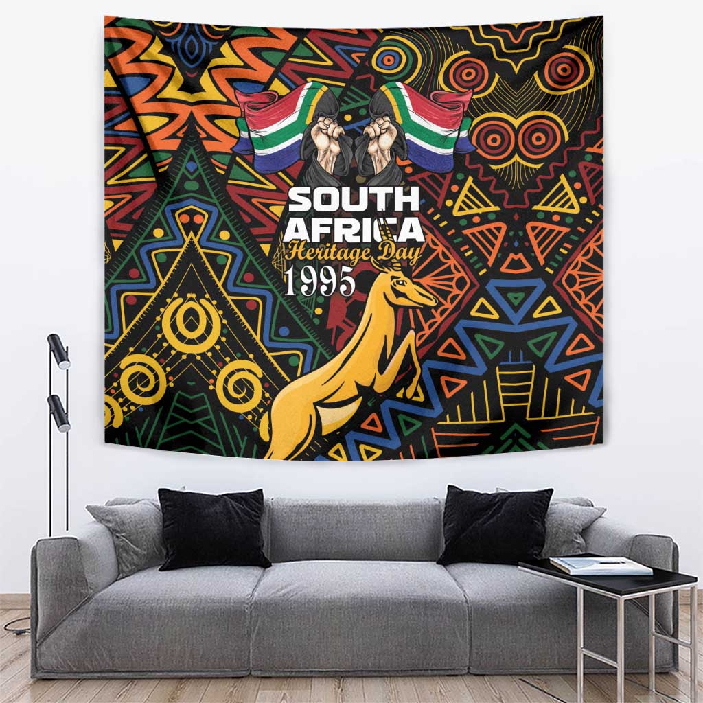 Black heritage day tapestry with Springbok, flags, and colorful geometric African pattern
