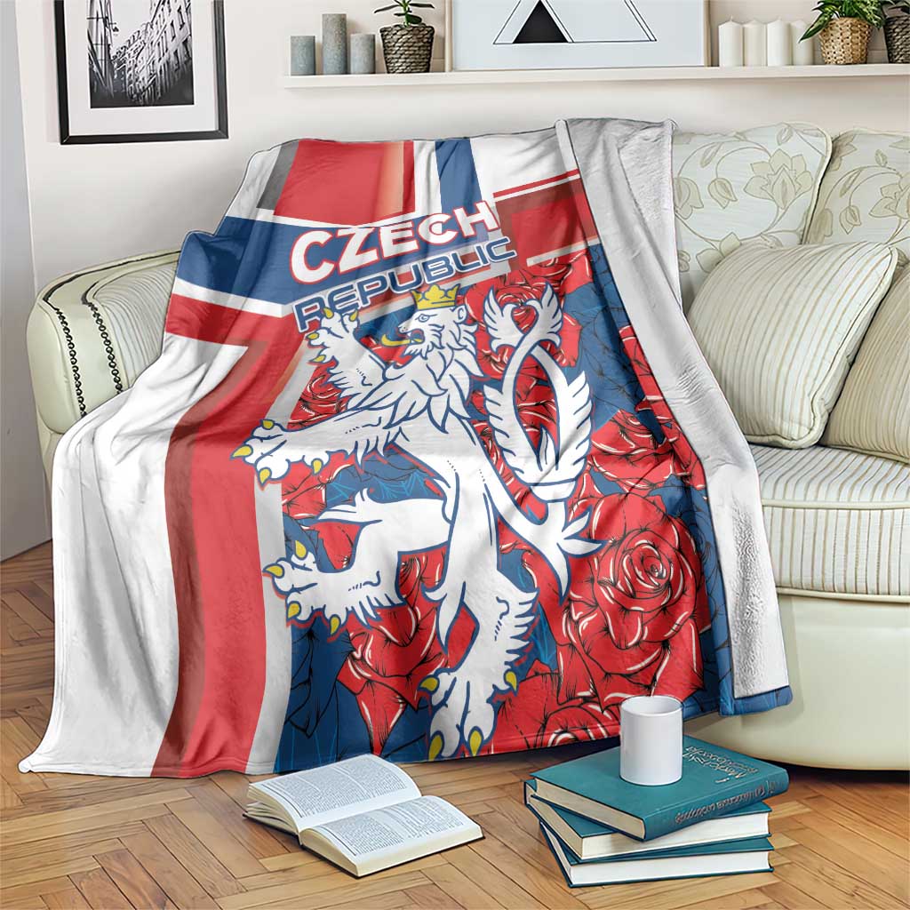 Red, blue and white lion graphic blanket draped on a bed