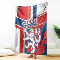 Red, blue and white lion graphic blanket draped over the side