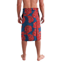 Printed swim shorts with red rose pattern on blue fabric