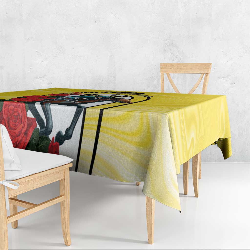 Yellow tablecloth draped on dining table, with horse head and red roses graphic