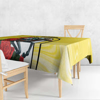 Yellow tablecloth draped on dining table, with horse head and red roses graphic