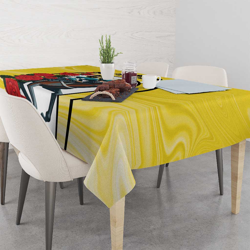 Yellow tablecloth with horse-racing emblem and red rose bouquet print