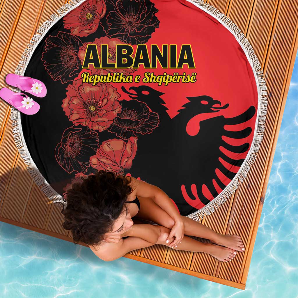 Red round beach blanket with floral Albania eagle design and white fringe edge