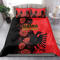Red and black bedding set with poppy floral design, Albanian eagle emblem on duvet and pillows