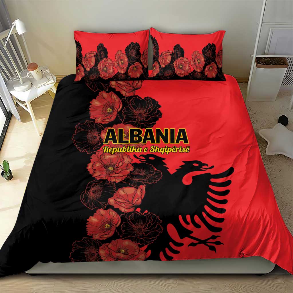 Red and black bedding set featuring poppy florals and Albanian eagle emblem, with matching pillows