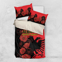 Red and black duvet cover with poppy floral print and Albanian eagle graphic, two pillowcases