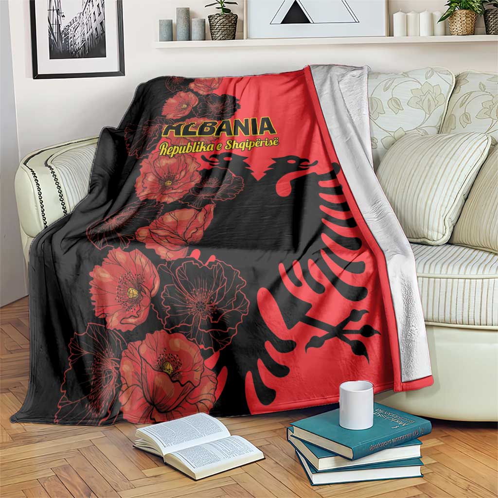 Red and black Albania-themed throw blanket with floral poppy print and eagle graphic