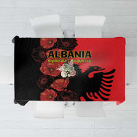 Red and black floral tablecloth with eagle emblem and bird silhouette design