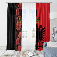 Red and black printed window curtains with poppy florals and eagle emblem