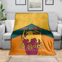 Sri Lanka flag-style blanket spread out, showing golden lion and Sri Lanka text