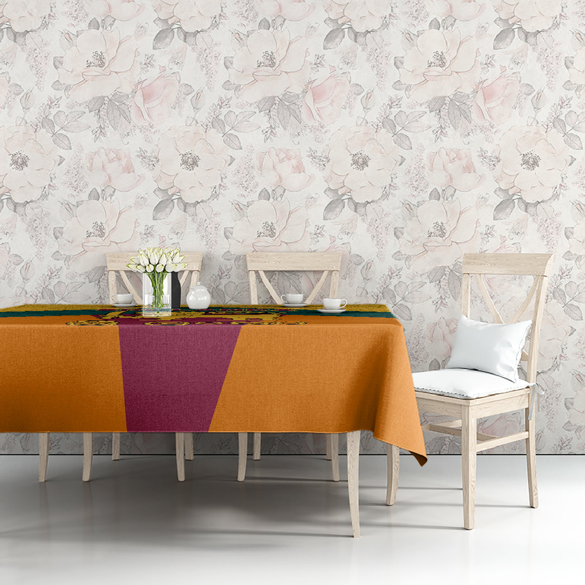 Flag-style tablecloth with orange, teal, and purple panels and central emblem