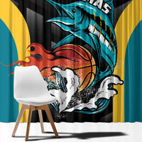 Close-up black curtain showing teal fish basketball graphic with red and gold accents.