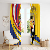 Yellow window curtain panels with toucan graphic and blue/red/white diagonal stripes.