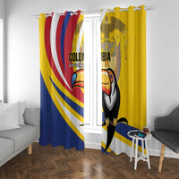 Yellow window curtain panels with toucan print and metal hooks on top header.