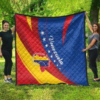 Venezuela themed quilt blanket spread outdoors, red yellow blue design with star crest and script