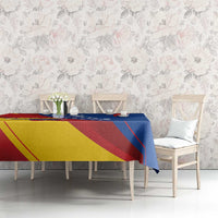 Venezuela flag tablecloth on long table with chairs, blue red and yellow diagonal design