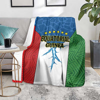 Equatorial Guinea flag blanket on sofa, red blue green panels with stars and country text