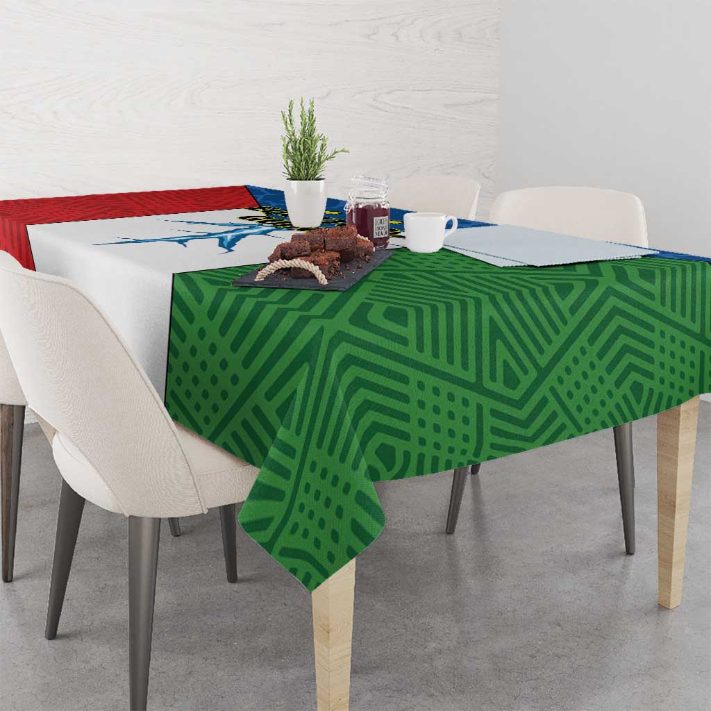 Colorful tablecloth over rectangular table, green geometric side with red panel and blue center