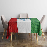 Colorful tablecloth with red, white, green geometric blocks on a square table